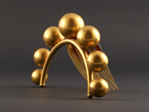 Peigne articulé aux boules d'or